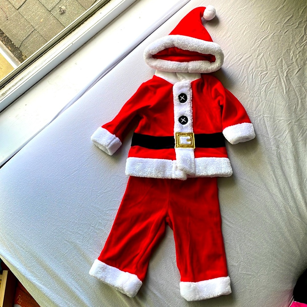 A one-set Santa Claus Outfit for babies 3 - 6 months.